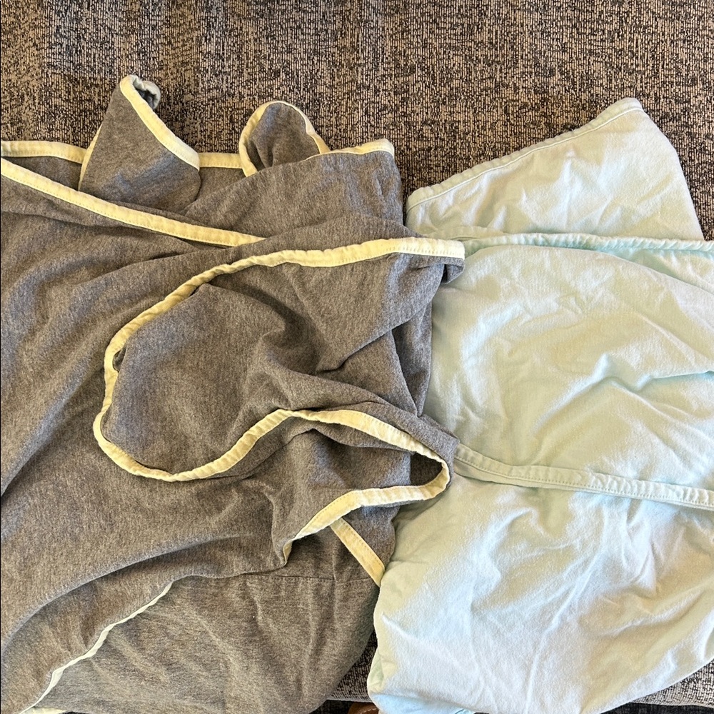 Two “miracle me” infant swaddles